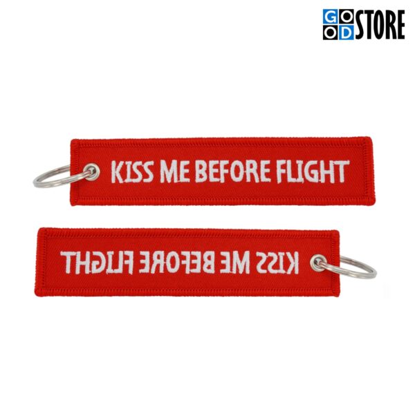 Punane "Kiss Me Before Flight" võtmehoidja